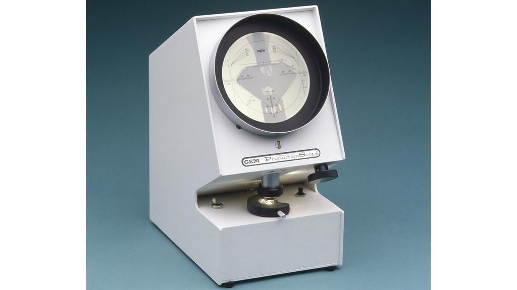 The first version of the ProportionScope (image at top of article) did not attach to a microscope but was held in front of it by the grader; a later version of the diamond grading instrument is pictured here. Historic picture of GIA ProportionScope (Photo © GIA)